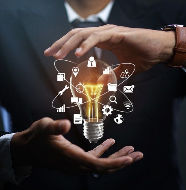 Technology ideas surrounding a glowing bulb during ideation